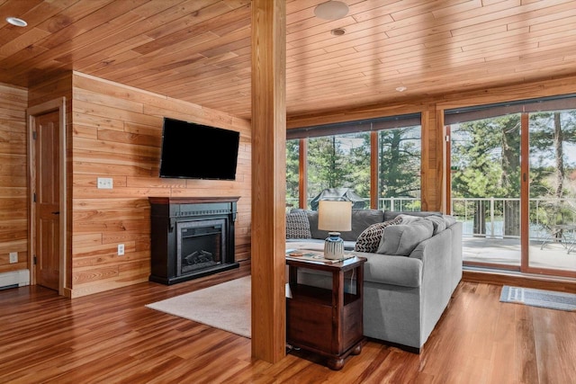 N2307 Whispering Pines Rd, Waupaca, WI 54981 - living room with wood ceiling, a fireplace, wood walls, and wood finished floors