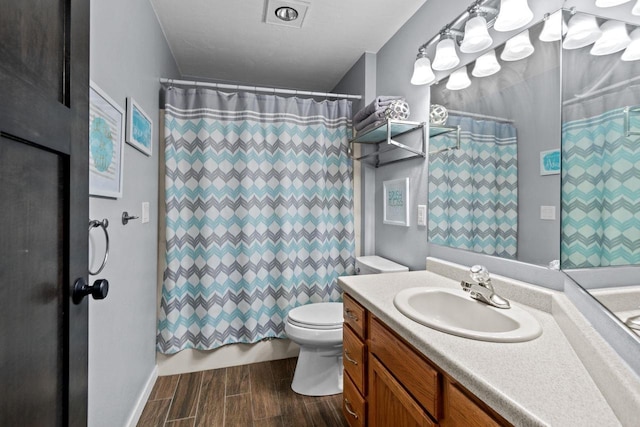 full bath featuring wood tiled floors, toilet, and vanity