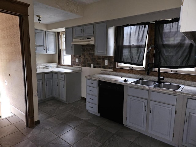 3513 Washington Ave, Racine, WI 53405 - kitchen featuring dishwasher, under cabinet range hood, a sink, decorative backsplash, and gray cabinets