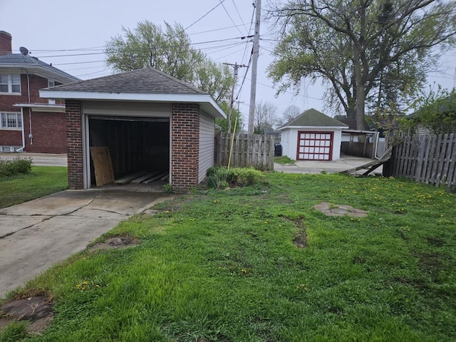 3513 Washington Ave, Racine, WI 53405 - view of yard with an outdoor structure and concrete driveway