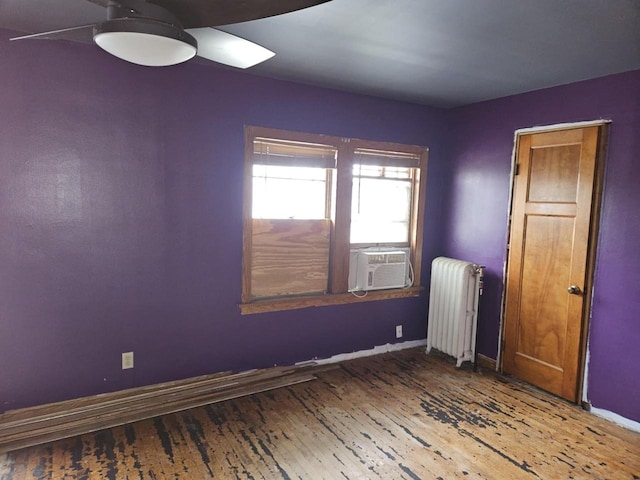 3513 Washington Ave, Racine, WI 53405 - spare room with radiator heating unit, cooling unit, baseboards, and ceiling fan