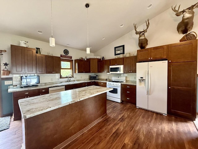 520 Alyssa St, Tomah, WI 54660 - kitchen with white appliances, decorative backsplash, a sink, dark wood finished floors, and high vaulted ceiling