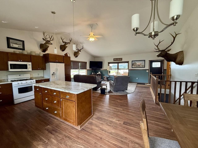 520 Alyssa St, Tomah, WI 54660 - kitchen featuring white appliances, a ceiling fan, dark wood finished floors, pendant lighting, and high vaulted ceiling