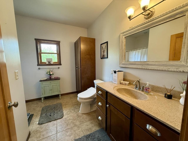 520 Alyssa St, Tomah, WI 54660 - bathroom featuring vanity, toilet, tile patterned floors, and baseboards