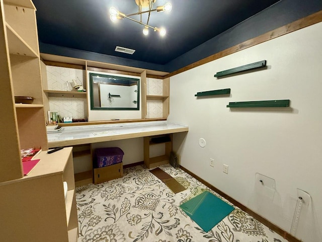 520 Alyssa St, Tomah, WI 54660 - bathroom featuring a chandelier and baseboards