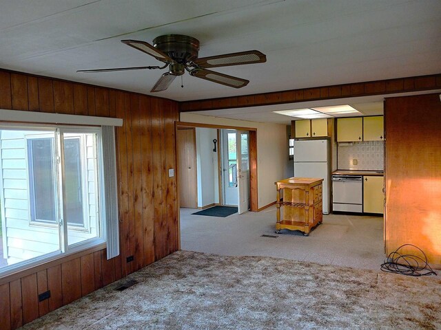 5544 Elm Rd, Pittsville, WI 54466 - unfurnished living room with light carpet, wooden walls, and ceiling fan