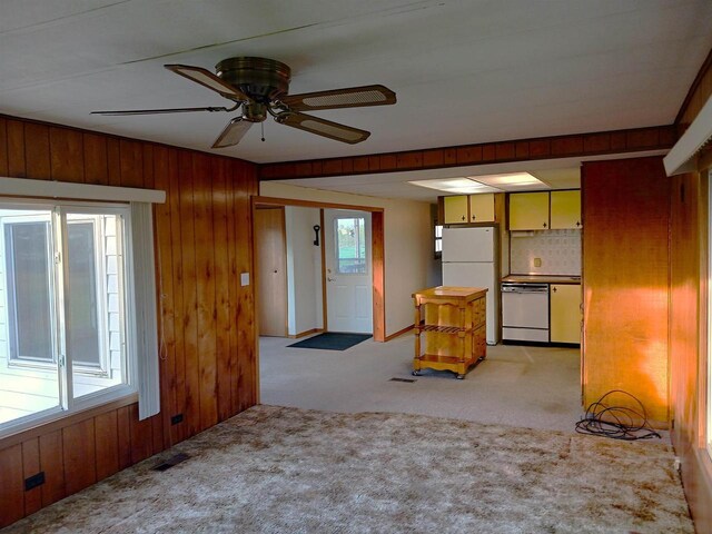 5544 Elm Rd, Pittsville, WI 54466 - unfurnished living room with light carpet, wood walls, and a ceiling fan