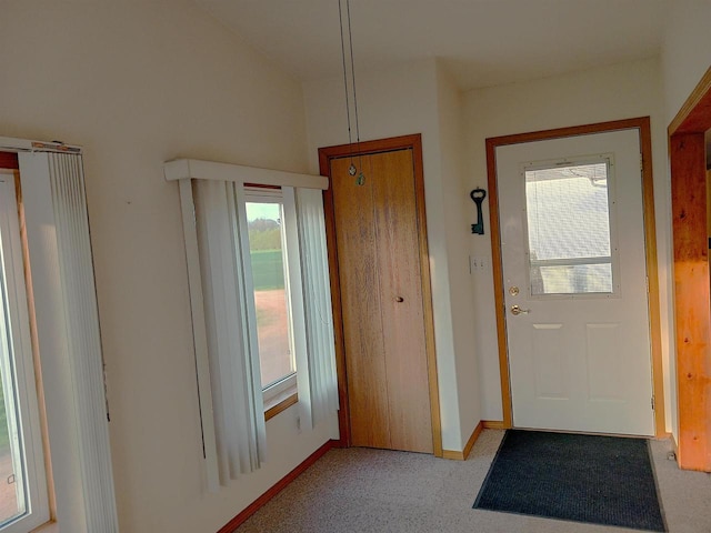 5544 Elm Rd, Pittsville, WI 54466 - doorway featuring plenty of natural light, baseboards, and light colored carpet