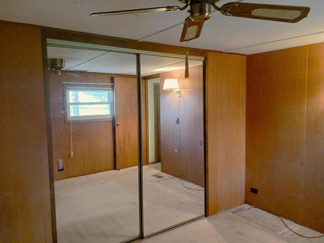 5544 Elm Rd, Pittsville, WI 54466 - unfurnished bedroom featuring light colored carpet, wooden walls, and a closet