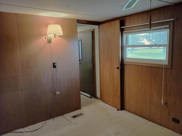 5544 Elm Rd, Pittsville, WI 54466 - empty room featuring wood walls and carpet floors