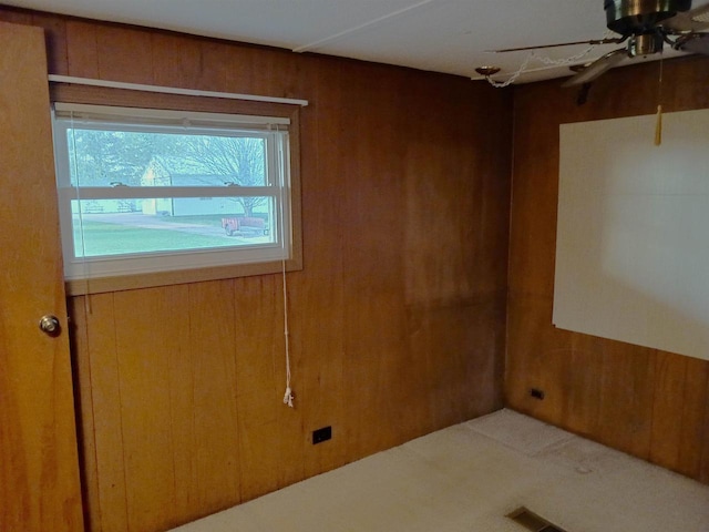 5544 Elm Rd, Pittsville, WI 54466 - carpeted empty room with a ceiling fan and wood walls
