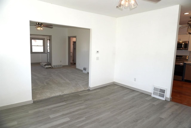 501 N Prospect St, Merrill, WI 54452 - empty room featuring a ceiling fan, light wood-style flooring, and baseboards