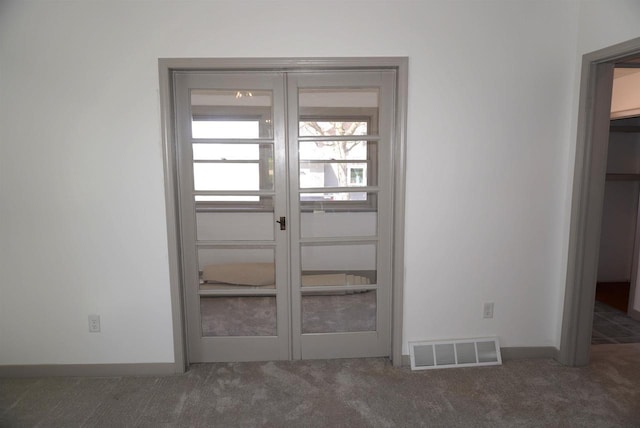 501 N Prospect St, Merrill, WI 54452 - doorway to outside featuring carpet floors and baseboards
