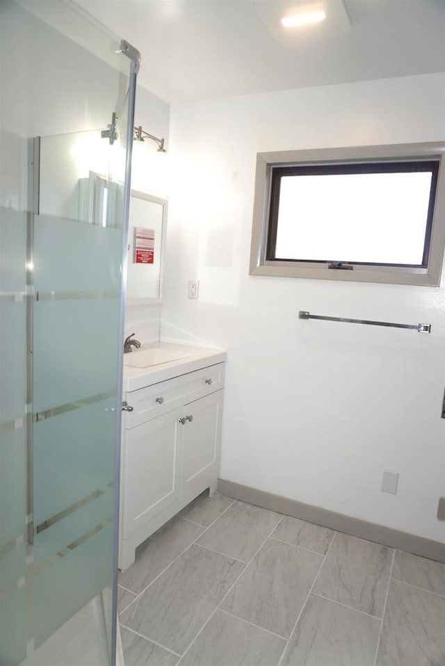 501 N Prospect St, Merrill, WI 54452 - full bath featuring vanity, baseboards, a shower stall, and marble finish floors