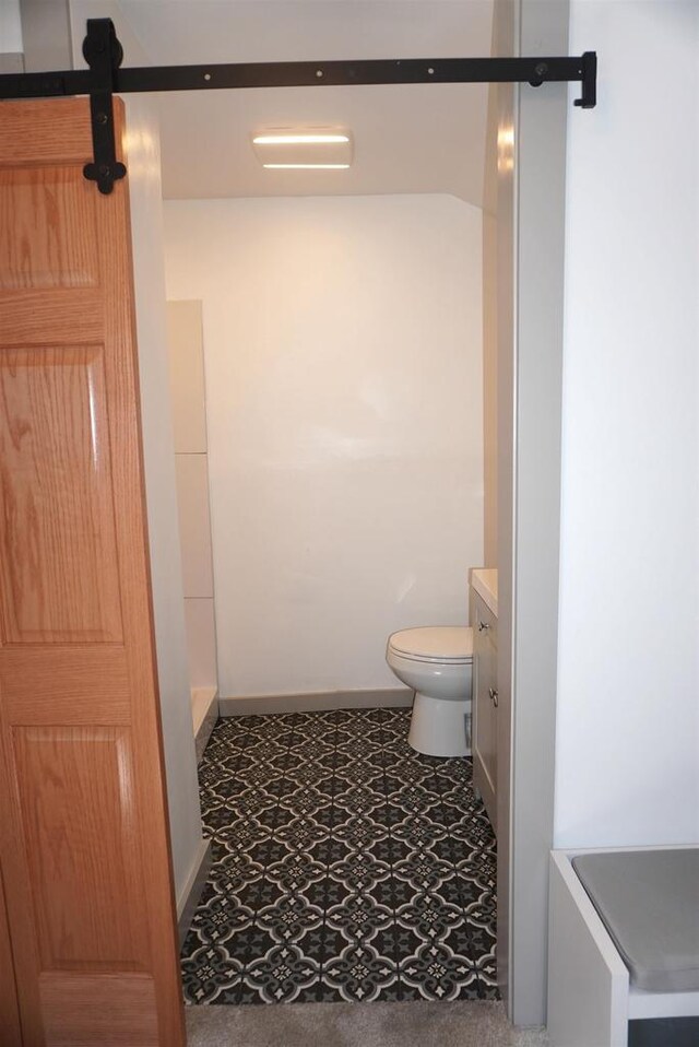 501 N Prospect St, Merrill, WI 54452 - bathroom featuring toilet, vanity, baseboards, and tile patterned floors