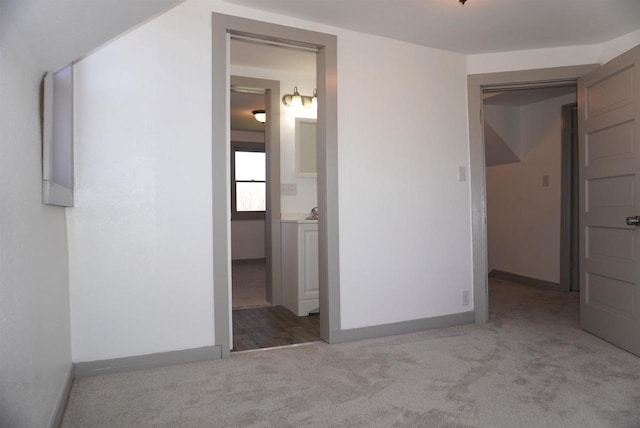 501 N Prospect St, Merrill, WI 54452 - unfurnished bedroom featuring carpet flooring, baseboards, and connected bathroom