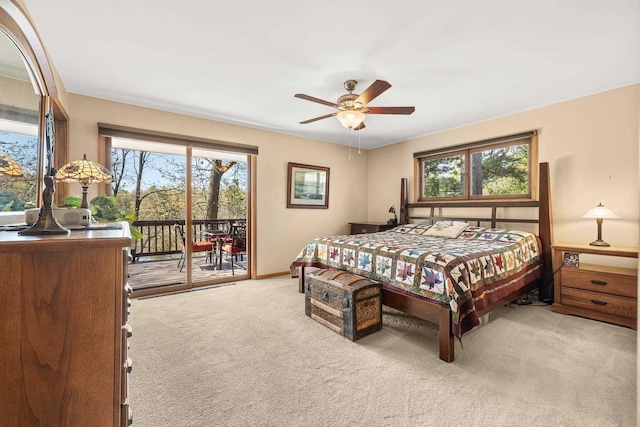 528 Park Ave, Waupaca, WI 54981 - bedroom featuring access to exterior, carpet, baseboards, and a ceiling fan