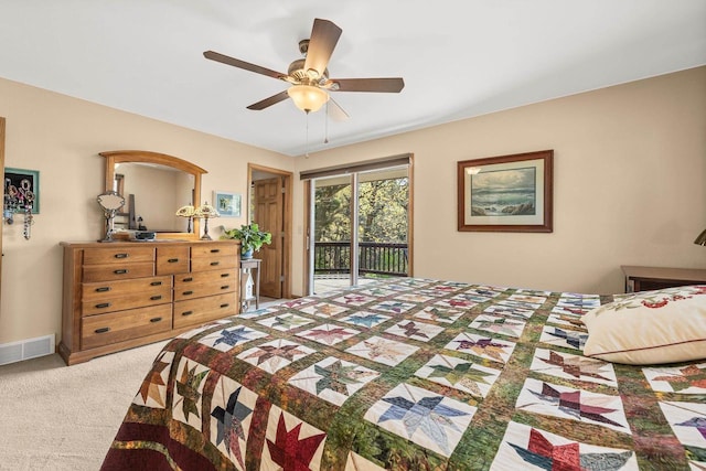 528 Park Ave, Waupaca, WI 54981 - bedroom with access to exterior, carpet, and a ceiling fan