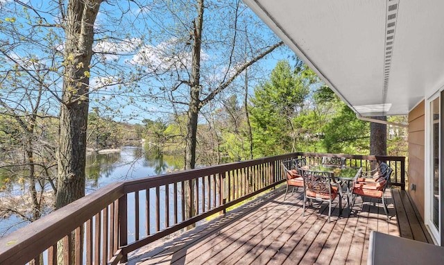528 Park Ave, Waupaca, WI 54981 - wooden deck with a water view and outdoor dining area