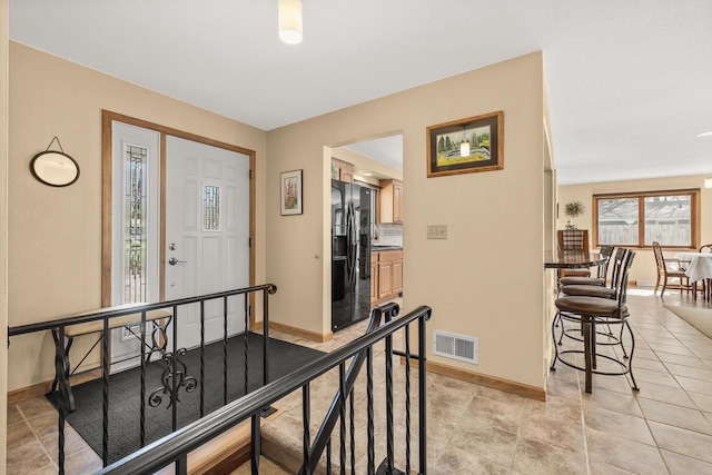 528 Park Ave, Waupaca, WI 54981 - entryway featuring baseboards and light tile patterned flooring