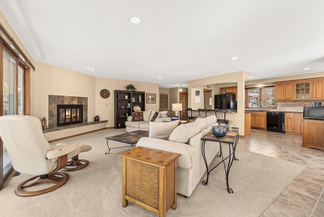 528 Park Ave, Waupaca, WI 54981 - living area featuring recessed lighting, a tiled fireplace, and light tile patterned floors