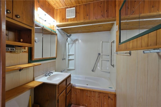 7266 County Road U, Danbury, WI 54830 - bathroom featuring decorative backsplash, bathing tub / shower combination, and vanity