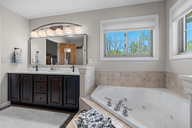 W6928 Westwood Dr, Fond Du Lac, WI 54937 - bathroom featuring a tub with jets and double vanity