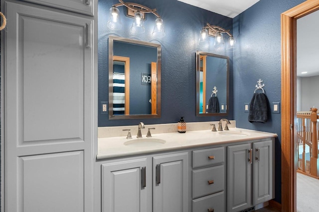 W6928 Westwood Dr, Fond Du Lac, WI 54937 - bathroom featuring a textured wall and double vanity