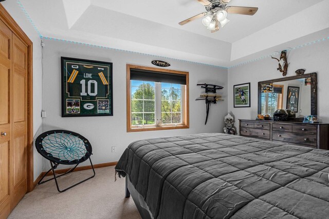 W6928 Westwood Dr, Fond Du Lac, WI 54937 - bedroom featuring carpet floors, baseboards, ceiling fan, and a tray ceiling