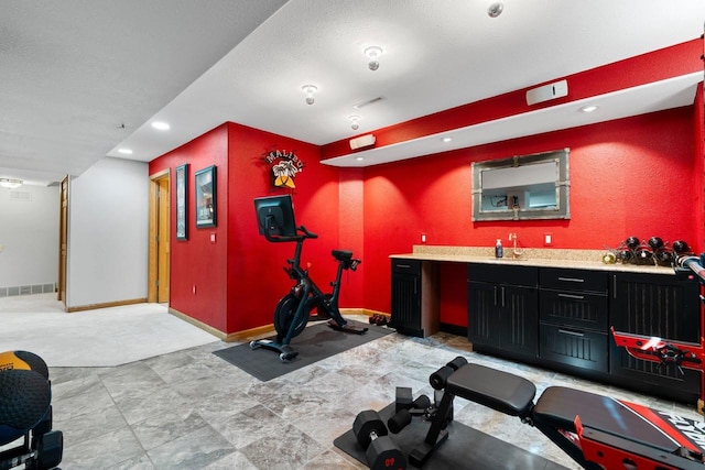 W6928 Westwood Dr, Fond Du Lac, WI 54937 - exercise room featuring bar with sink, baseboards, and recessed lighting