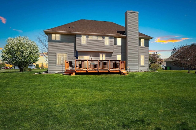 W6928 Westwood Dr, Fond Du Lac, WI 54937 - rear view of property featuring a deck, a yard, and a chimney