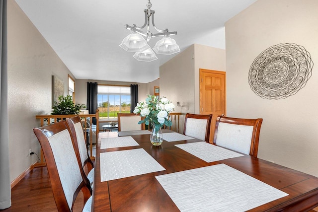 W6928 Westwood Dr, Fond Du Lac, WI 54937 - dining area featuring wood finished floors, a chandelier, lofted ceiling, and baseboards