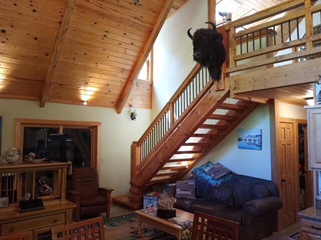 23540 State Highway 13, Cornucopia, WI 54827 - living area featuring wood ceiling, stairs, high vaulted ceiling, and beamed ceiling