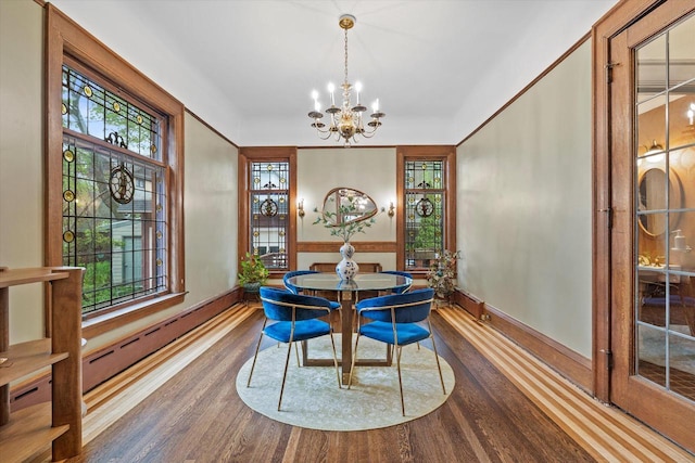2837 N Marietta Ave, Milwaukee, WI 53211 - dining room with a chandelier, dark wood-style floors, baseboards, and healthy amount of natural light