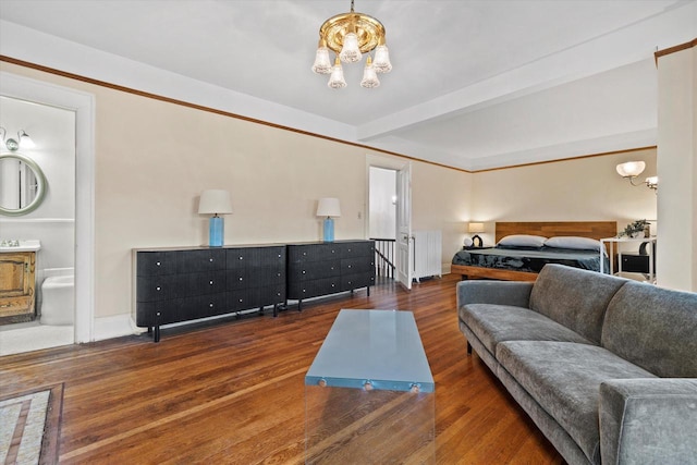 2837 N Marietta Ave, Milwaukee, WI 53211 - bedroom featuring radiator heating unit, a chandelier, wood finished floors, baseboards, and ensuite bath