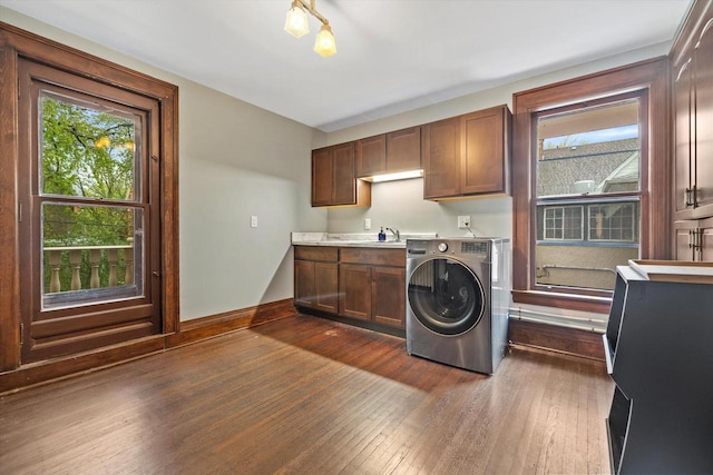 2837 N Marietta Ave, Milwaukee, WI 53211 - laundry area with washer / clothes dryer, cabinet space, dark wood finished floors, and baseboards