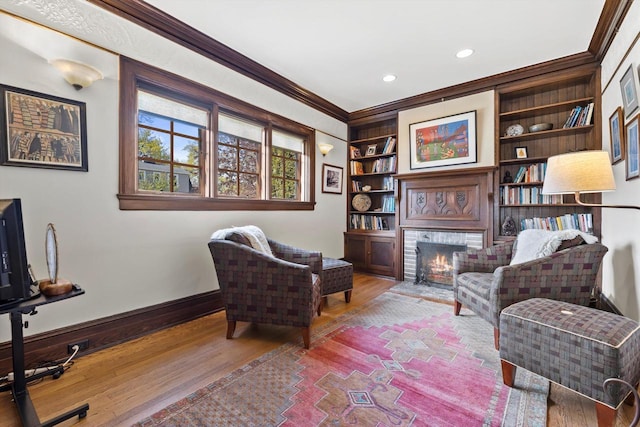 304 16th St, Racine, WI 53403 - living area with crown molding, wood finished floors, a fireplace, baseboards, and recessed lighting