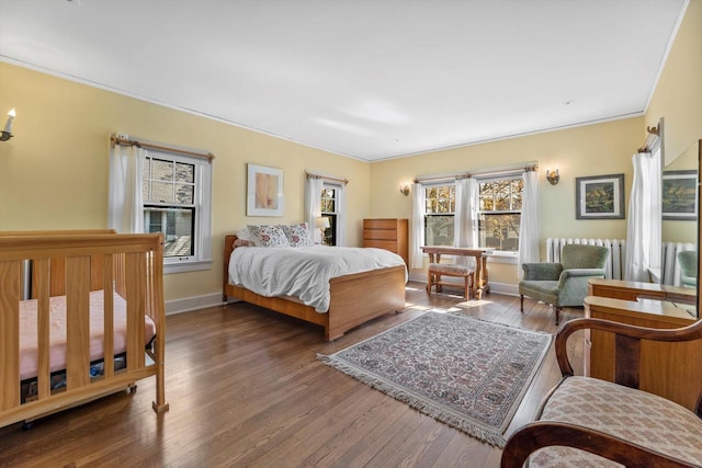 304 16th St, Racine, WI 53403 - bedroom featuring wood finished floors, baseboards, and crown molding