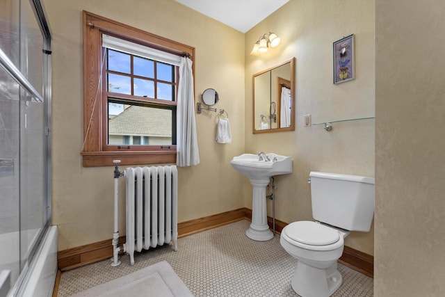 304 16th St, Racine, WI 53403 - full bathroom with radiator, toilet, baseboards, and combined bath / shower with glass door