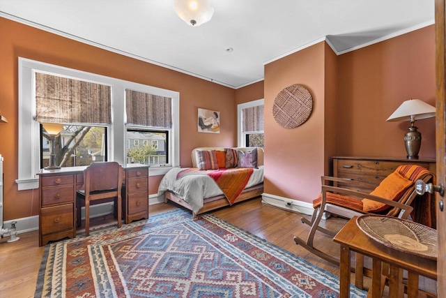 304 16th St, Racine, WI 53403 - bedroom with wood finished floors, multiple windows, ornamental molding, and baseboards