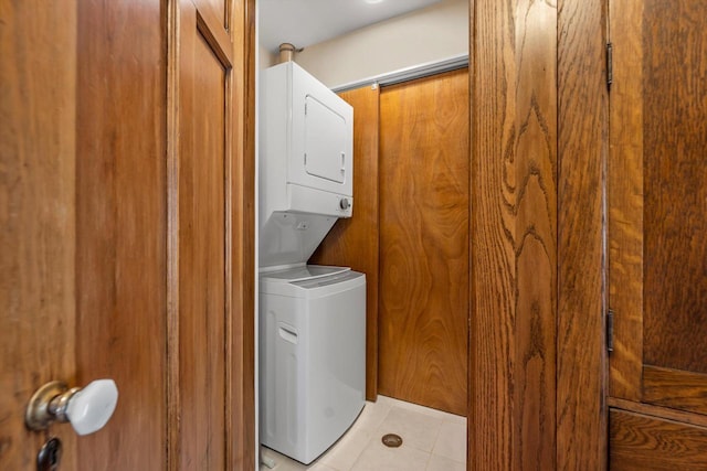 304 16th St, Racine, WI 53403 - washroom with estacked washer and dryer and light tile patterned flooring