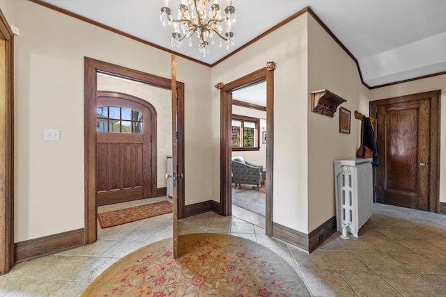 304 16th St, Racine, WI 53403 - entrance foyer with baseboards, a chandelier, ornamental molding, arched walkways, and light tile patterned floors
