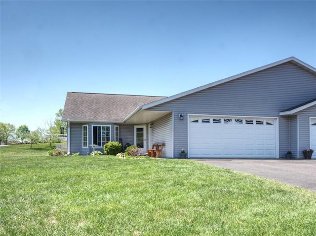 429 Riggs St, Bloomer, WI 54724 - ranch-style home featuring a garage, asphalt driveway, a front lawn, and a shingled roof