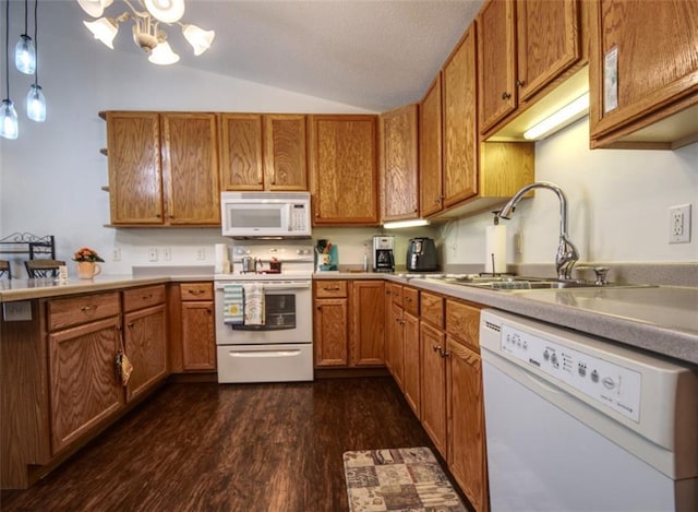 429 Riggs St, Bloomer, WI 54724 - kitchen featuring white appliances, a sink, brown cabinets, and lofted ceiling