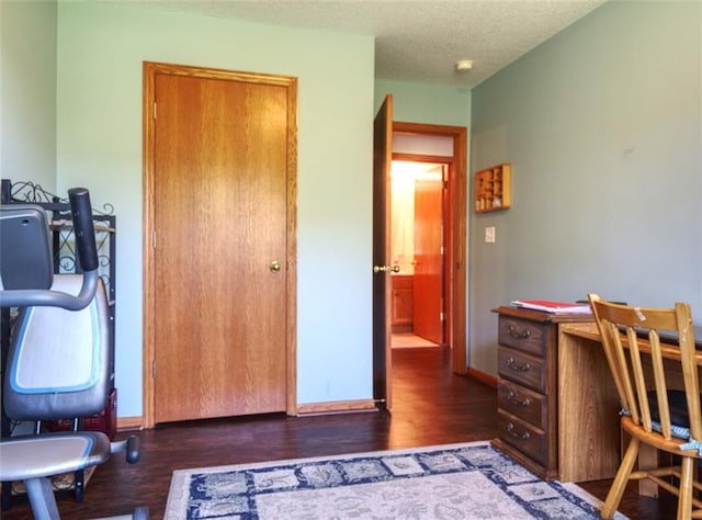 429 Riggs St, Bloomer, WI 54724 - office area featuring wood finished floors, a textured ceiling, and baseboards