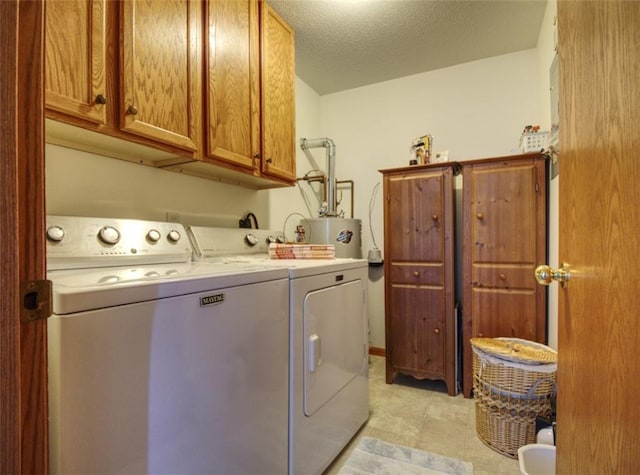 429 Riggs St, Bloomer, WI 54724 - laundry room with cabinet space, independent washer and dryer, electric water heater, and light tile patterned floors