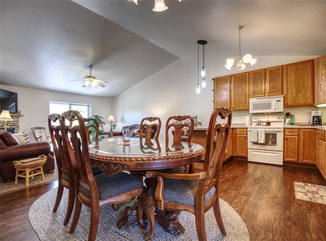 429 Riggs St, Bloomer, WI 54724 - dining area featuring vaulted ceiling, dark wood finished floors, a chandelier, and a ceiling fan