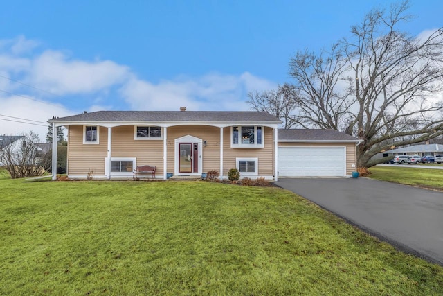 528 High St, Walworth, WI 53184 - bi-level home featuring a front yard, driveway, and a garage