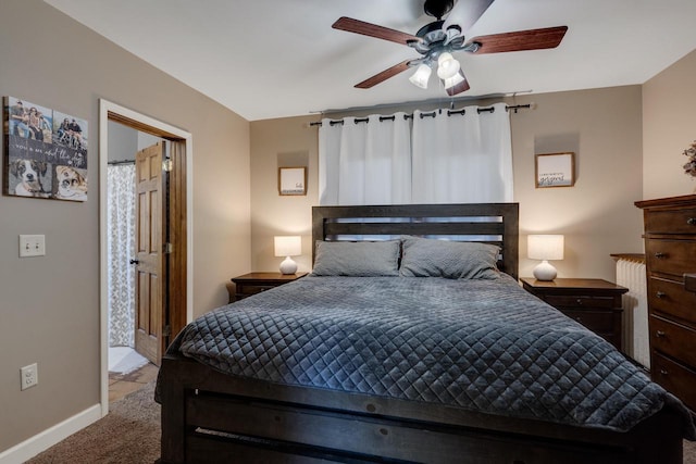 carpeted bedroom featuring baseboards and ceiling fan