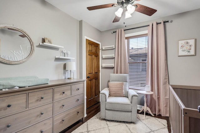 sitting room with a ceiling fan and light wood-type flooring